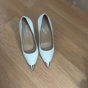 White , high heel pumps.